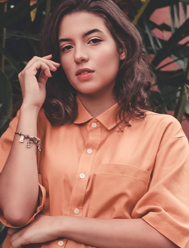 A girl in front of plants