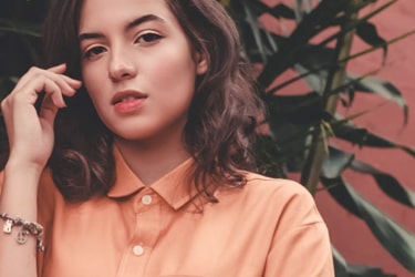 A girl in front of plants